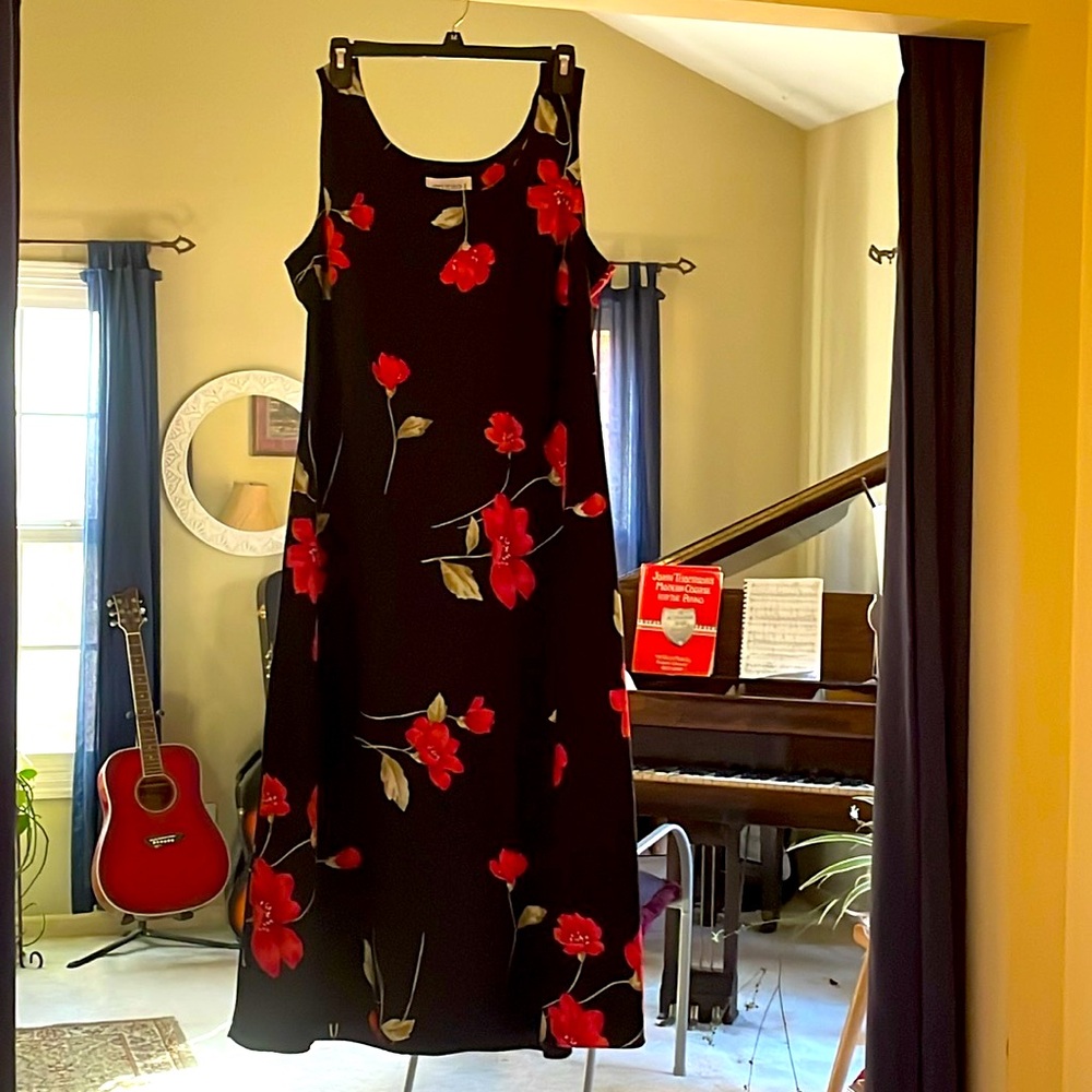 Sleeveless beautiful maxi dress, with red floral design. Size 14.